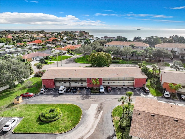 bird's eye view featuring a water view and a residential view