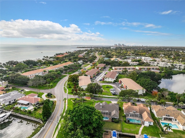 drone / aerial view featuring a residential view and a water view