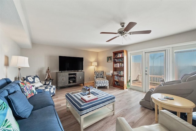 living area featuring a ceiling fan and light wood-style flooring