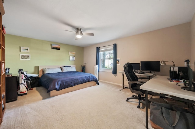 bedroom with ceiling fan, baseboards, and carpet flooring