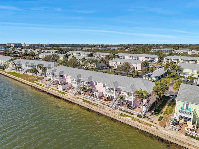 birds eye view of property with a water view and a residential view