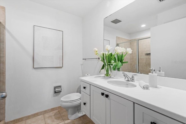 full bathroom featuring visible vents, toilet, vanity, tiled shower, and tile patterned floors