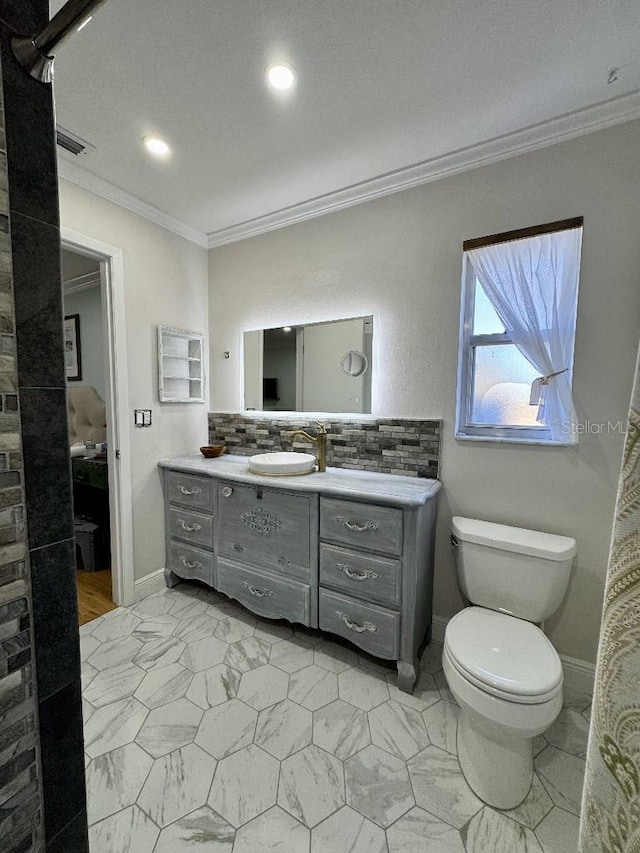 bathroom with marble finish floor, ornamental molding, vanity, and visible vents