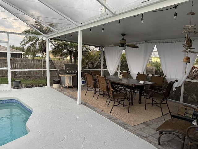 sunroom with plenty of natural light and ceiling fan