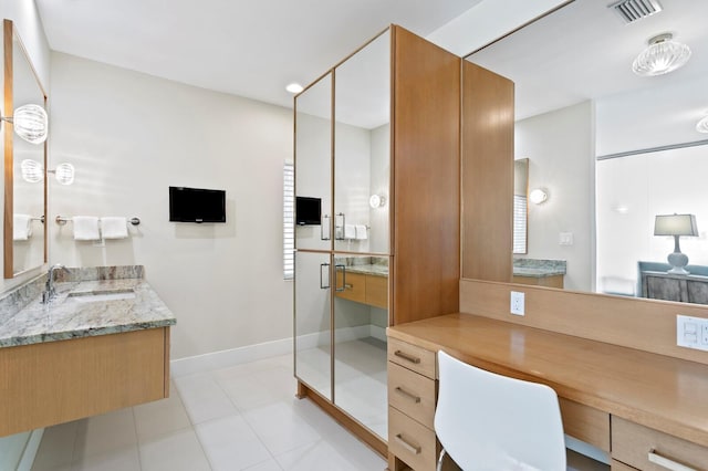 611 Brightwaters Blvd NE, Saint Petersburg, FL 33704 - full bath with vanity, visible vents, baseboards, tile patterned floors, and a stall shower