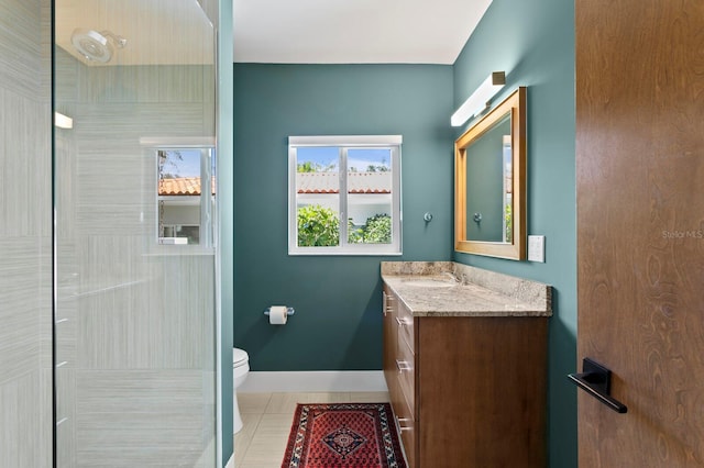 611 Brightwaters Blvd NE, Saint Petersburg, FL 33704 - full bathroom with baseboards, toilet, tile patterned flooring, walk in shower, and vanity
