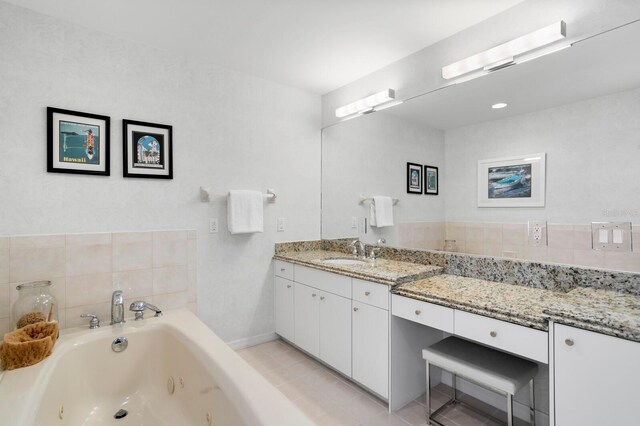 611 Brightwaters Blvd NE, Saint Petersburg, FL 33704 - full bathroom featuring a tub with jets and vanity