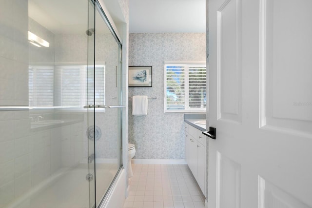 611 Brightwaters Blvd NE, Saint Petersburg, FL 33704 - bathroom featuring toilet, wallpapered walls, tile patterned flooring, and vanity