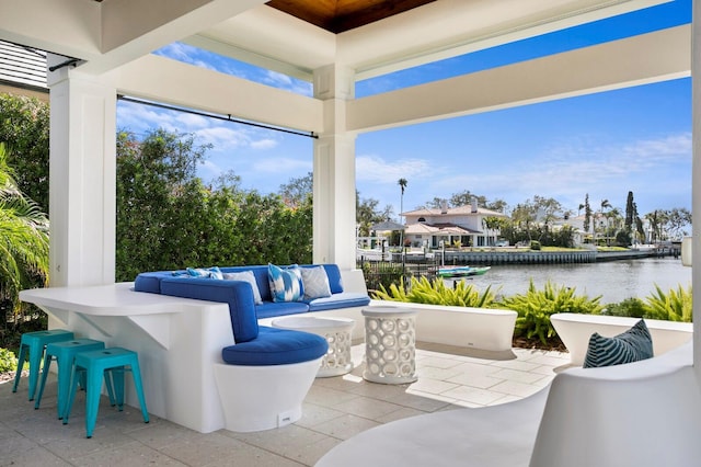 611 Brightwaters Blvd NE, Saint Petersburg, FL 33704 - view of patio / terrace with a water view and an outdoor living space