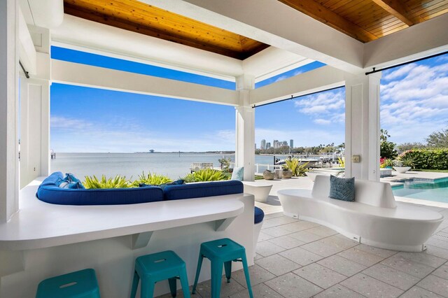 611 Brightwaters Blvd NE, Saint Petersburg, FL 33704 - view of patio / terrace featuring a water view and an outdoor pool