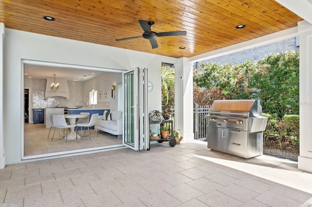 611 Brightwaters Blvd NE, Saint Petersburg, FL 33704 - view of patio with ceiling fan and grilling area