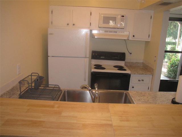 kitchen with light countertops, white cabinets, a sink, white appliances, and under cabinet range hood