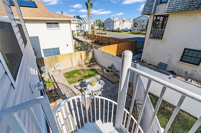 exterior space featuring a fenced backyard and a residential view