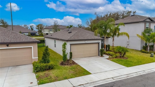 view of front facade featuring a residential view, concrete driveway, a front lawn, and stucco siding