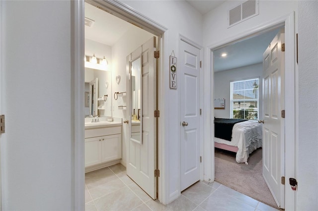 bathroom with vanity, ensuite bath, visible vents, and tile patterned floors