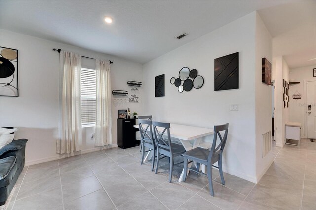 dining space featuring visible vents, baseboards, and light tile patterned floors