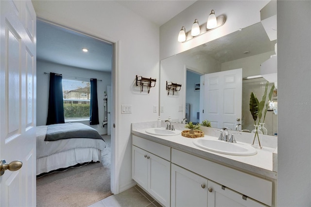 ensuite bathroom featuring a sink, double vanity, connected bathroom, and a shower with shower door