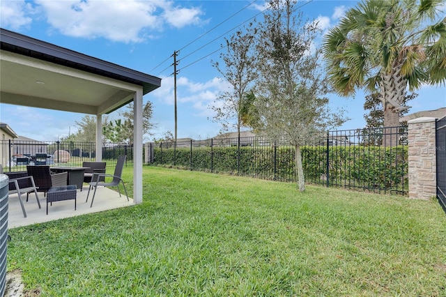 view of yard with a patio area and a fenced backyard