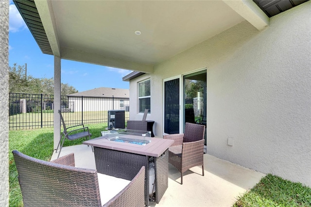 view of patio featuring fence