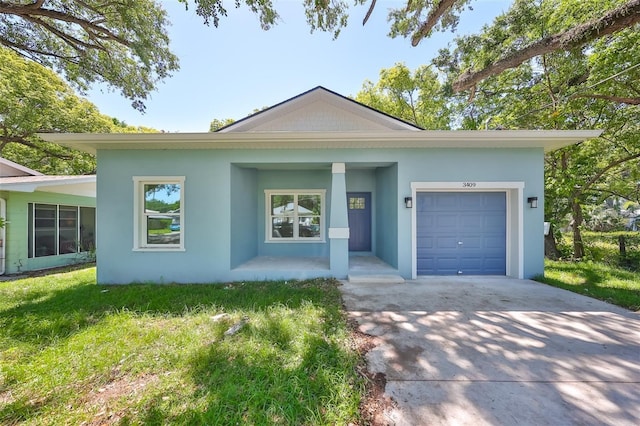 ranch-style home featuring concrete driveway, a front lawn, an attached garage, and stucco siding