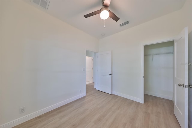 unfurnished bedroom featuring light wood-style flooring, visible vents, and baseboards