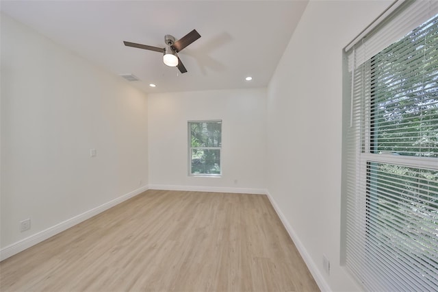 spare room featuring ceiling fan, recessed lighting, visible vents, baseboards, and light wood-type flooring