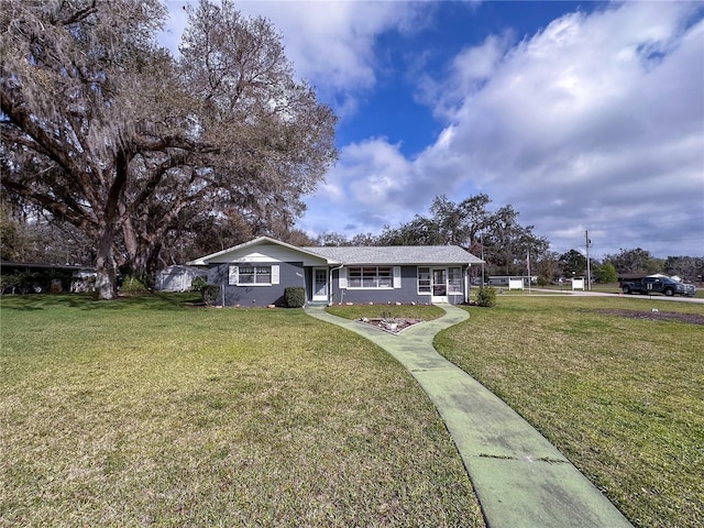 single story home featuring a front yard