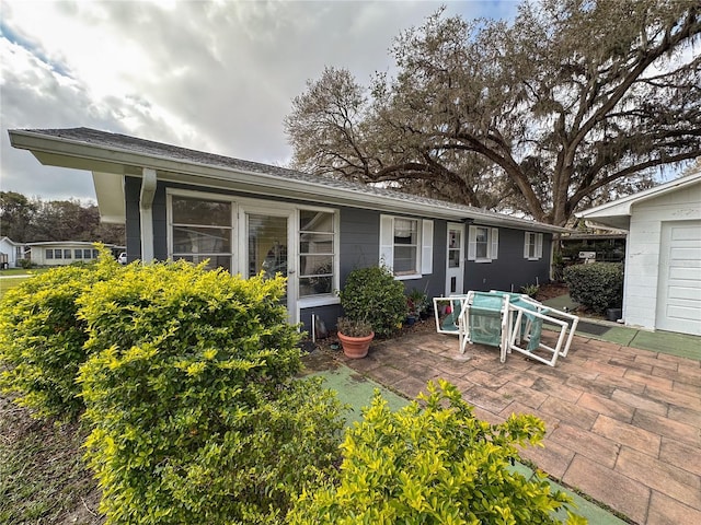 rear view of house featuring a patio area