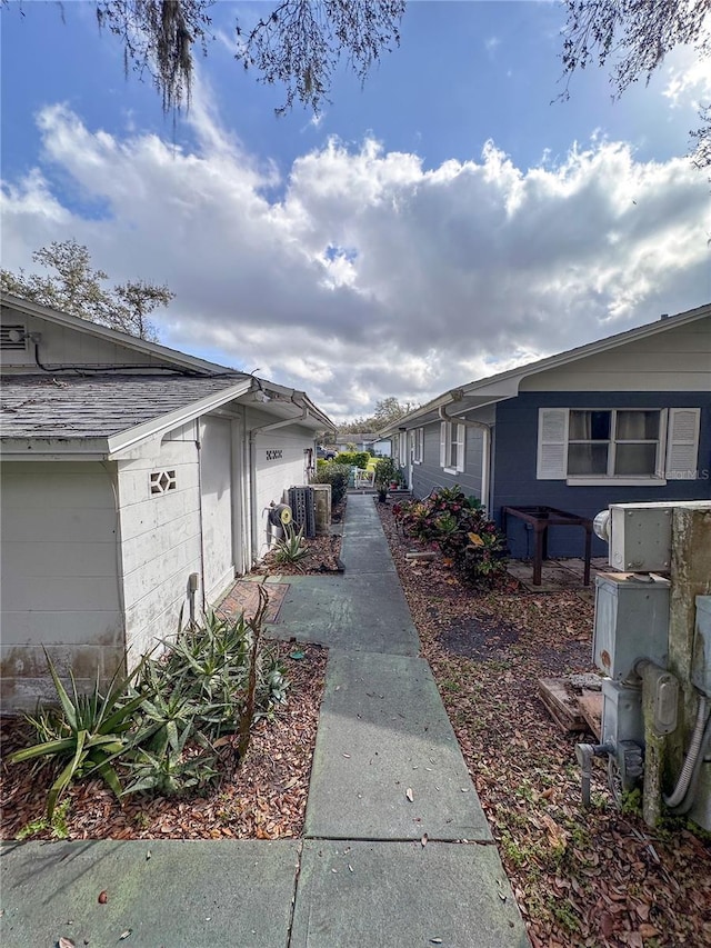 view of side of home featuring cooling unit