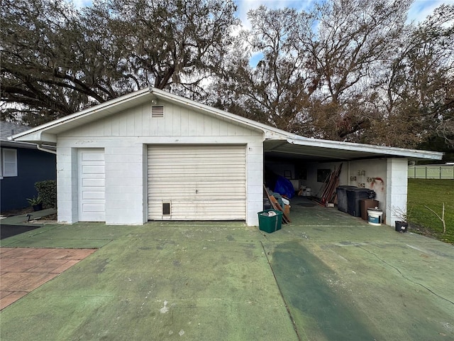 garage featuring a garage and driveway