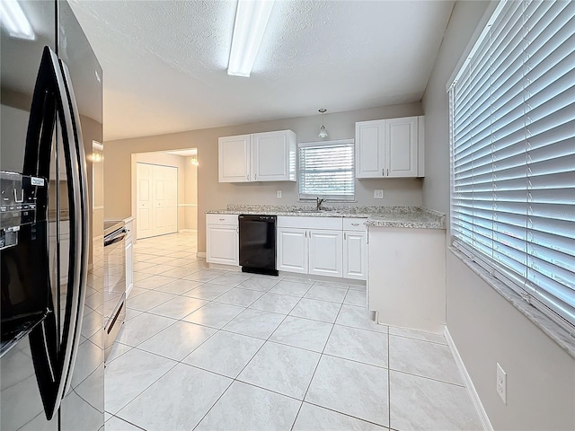 kitchen featuring white cabinetry, black appliances, a textured ceiling, light tile patterned flooring, and baseboards