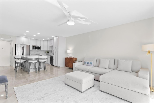 living room featuring recessed lighting and ceiling fan