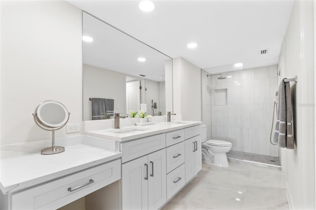 full bath featuring double vanity, a sink, visible vents, and a shower stall