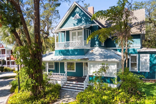 victorian home featuring a chimney