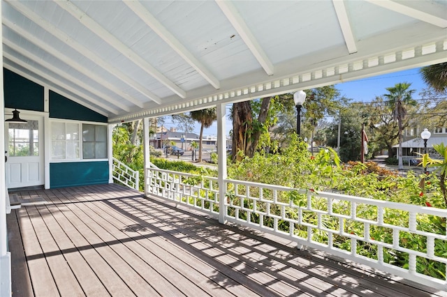 wooden terrace with a sunroom