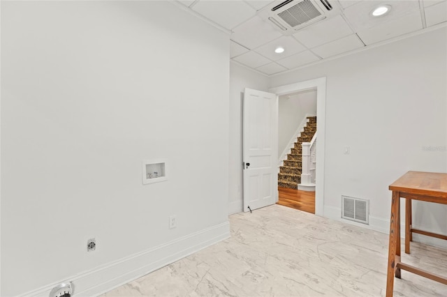 spare room with marble finish floor, visible vents, stairway, and baseboards