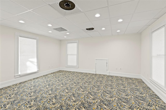 unfurnished room with carpet floors, recessed lighting, visible vents, and baseboards