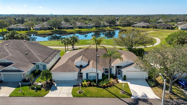 bird's eye view with a residential view and a water view