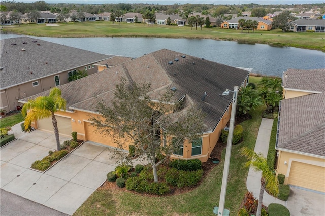 birds eye view of property featuring a residential view and a water view