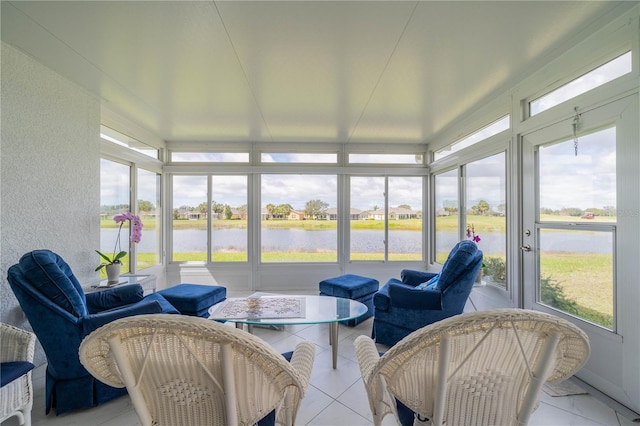 sunroom / solarium with a wealth of natural light and a water view