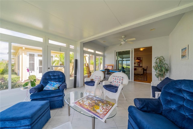 sunroom featuring a ceiling fan