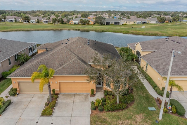 bird's eye view with a residential view and a water view