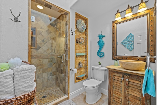 full bath with baseboards, toilet, a stall shower, tile patterned floors, and vanity