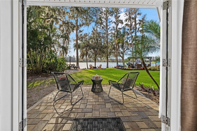 view of patio / terrace with a water view