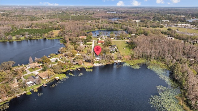 bird's eye view featuring a view of trees and a water view