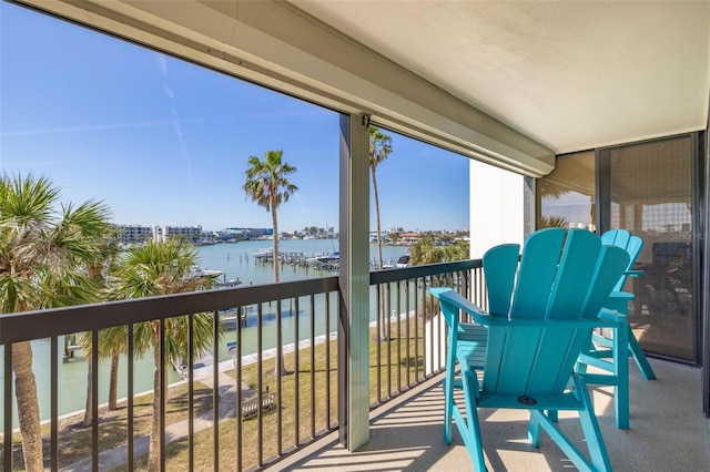 balcony featuring a water view