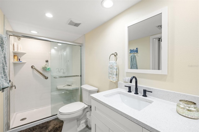 full bathroom with toilet, a stall shower, vanity, and visible vents