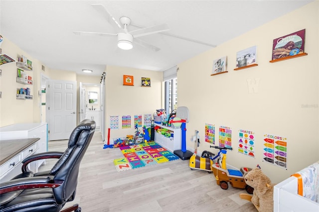 office area with ceiling fan and light wood-style flooring