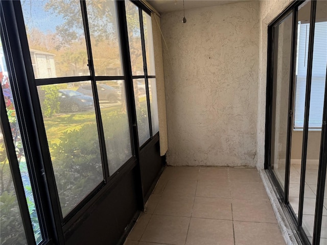 unfurnished sunroom with a healthy amount of sunlight