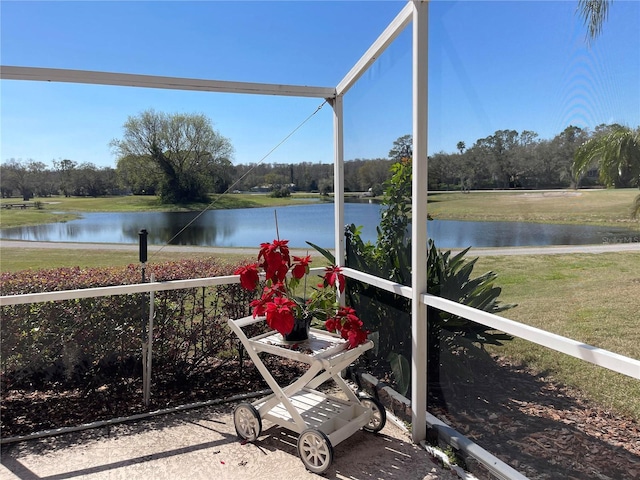 unfurnished sunroom with a water view